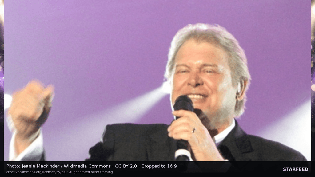 John Farnham performing live with a microphone