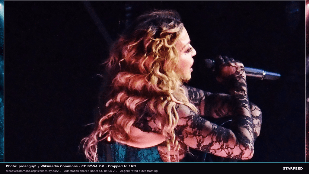 Madonna beneath concert lighting during her Celebration Tour